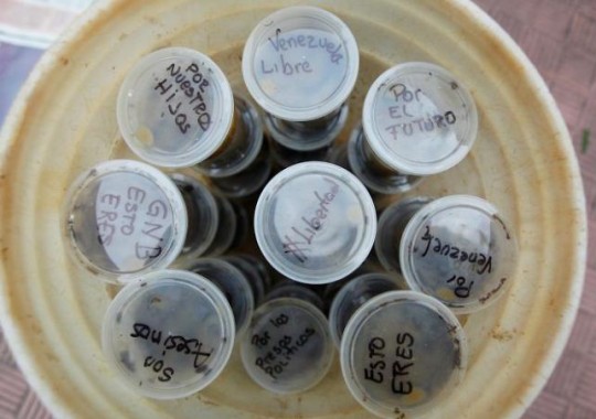 Messages are seen on plastic containers filled with feces, called "Poopootovs", which is a play on Molotov cocktails, before they are thrown at security forces during protests, in addition to the usual rocks and petrol bombs, in Caracas